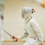 person holding black sabre dagger