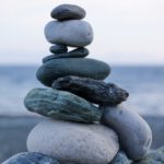 a stack of rocks sitting on top of a beach